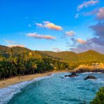 Mountain and forest collide right into serene beach