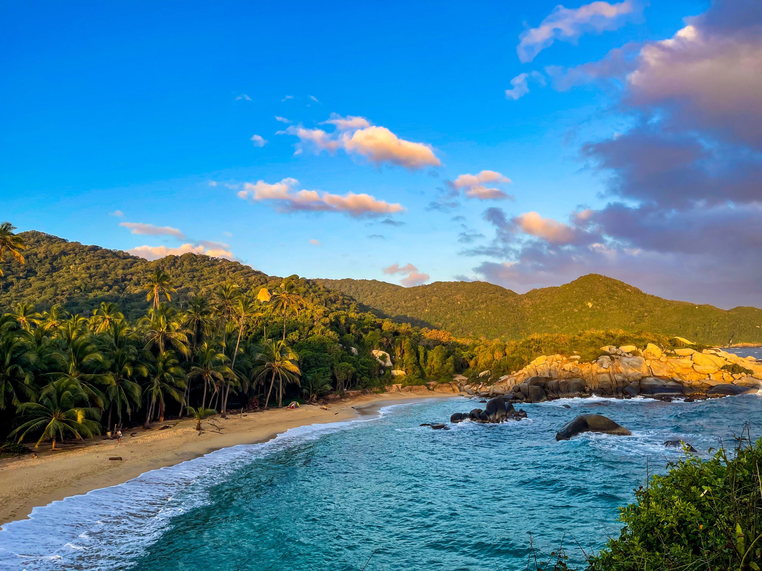 Mountain and forest collide right into serene beach
