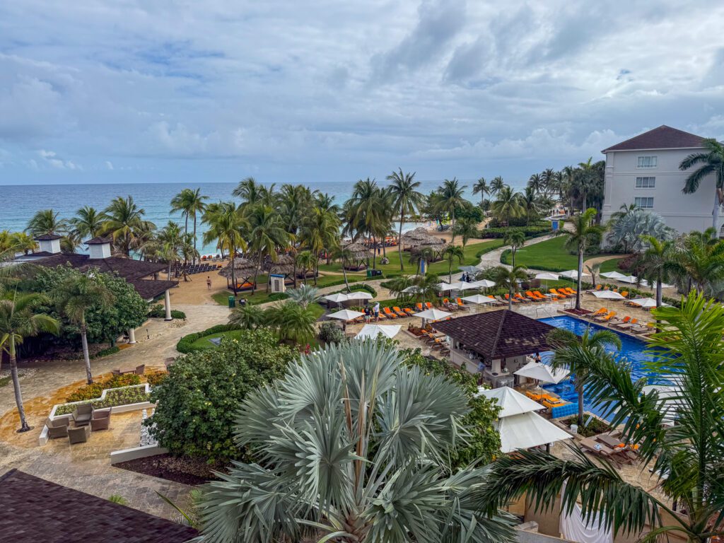View overlooking the pool and beachfront at Hyatt Zilara Rose Hall, with ocean views and tropical landscaping in Montego Bay, Jamaica.