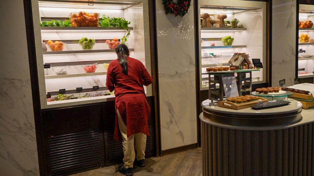 Fresh fruit and dessert station inside the Singapore Airlines SilverKris Lounge at Changi Airport.