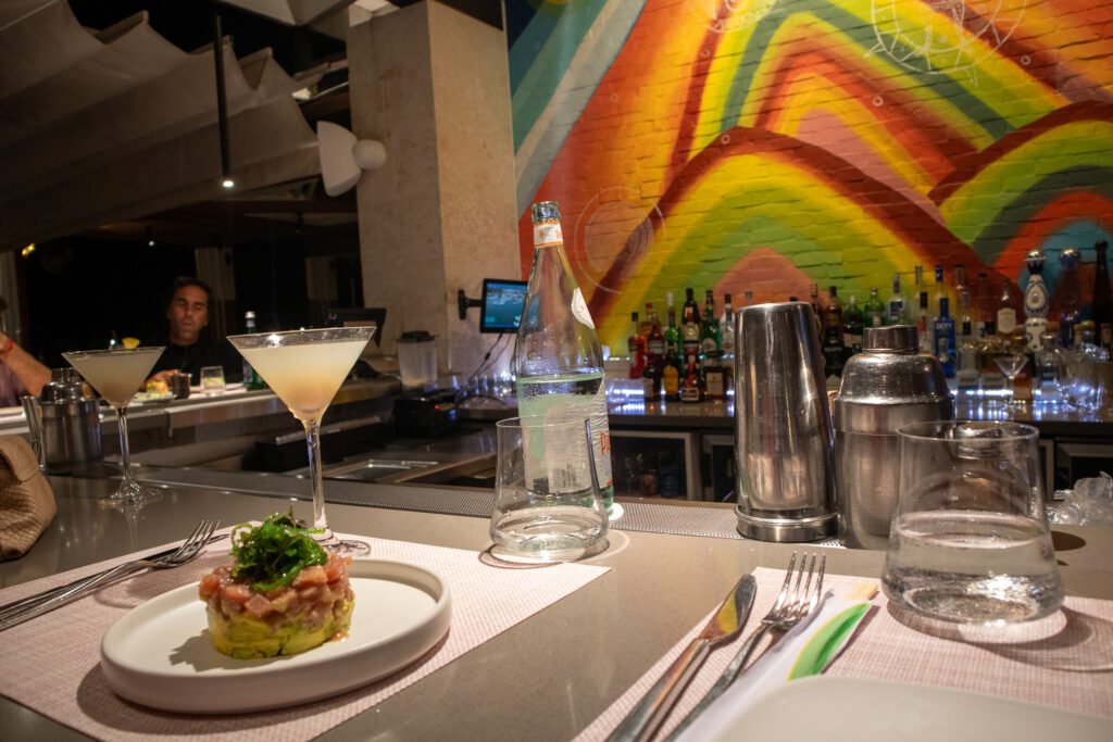 Elegant cocktails and plated food at a Casa de Campo restaurant, highlighting the resort’s upscale dining scene
