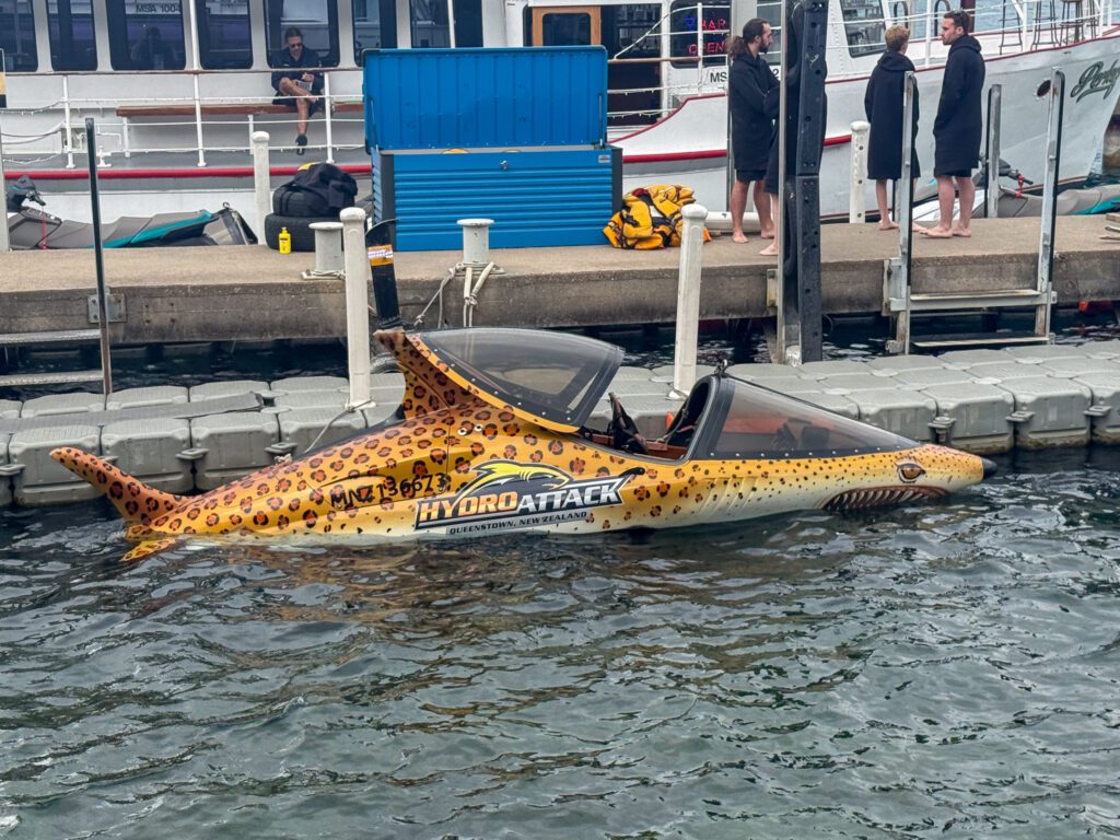 Hydro Attack jet boat docked in Queenstown Harbor before an adrenaline ride on Lake Wakatipu
