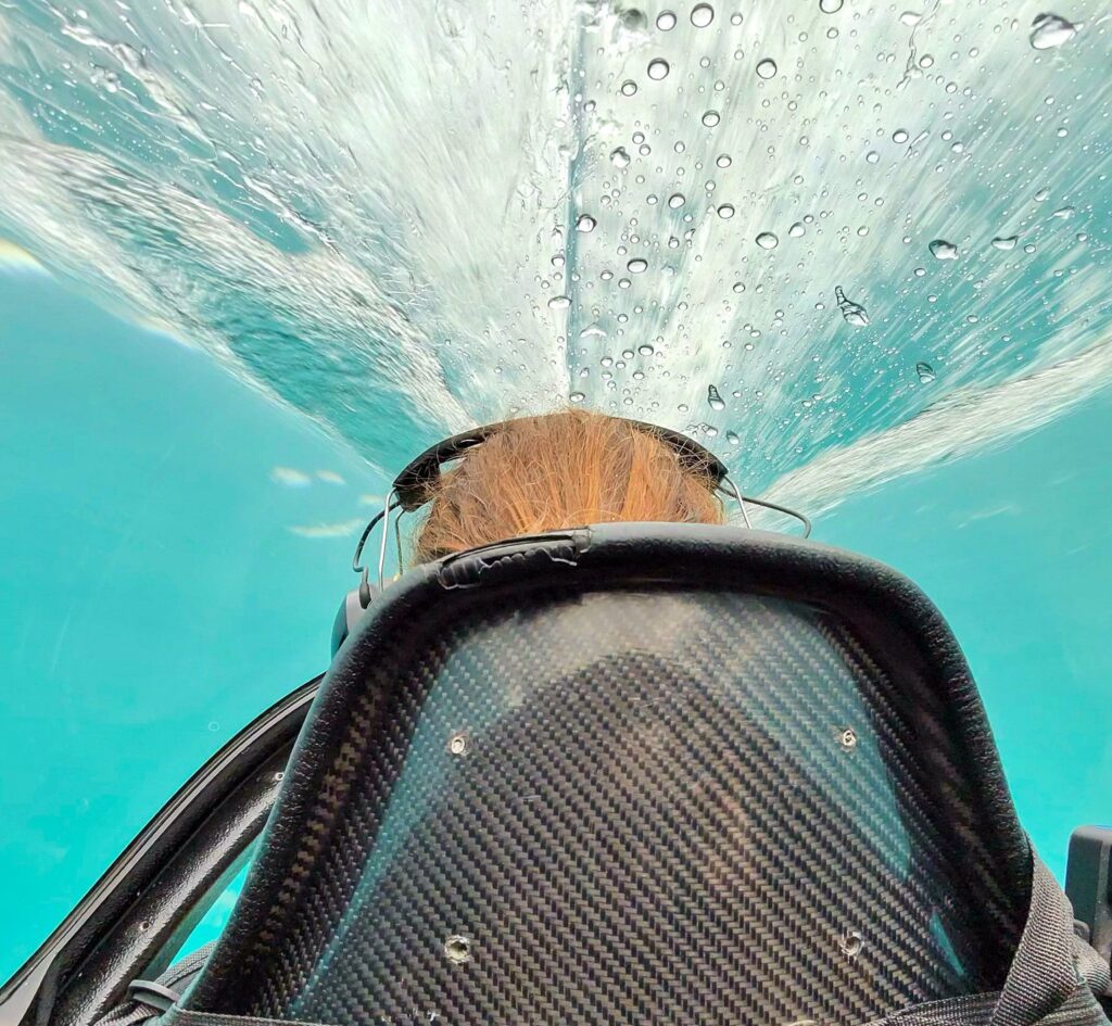 Water splashing over the cockpit during a Queenstown Hydro Attack jet boat dive in Lake Wakatipu