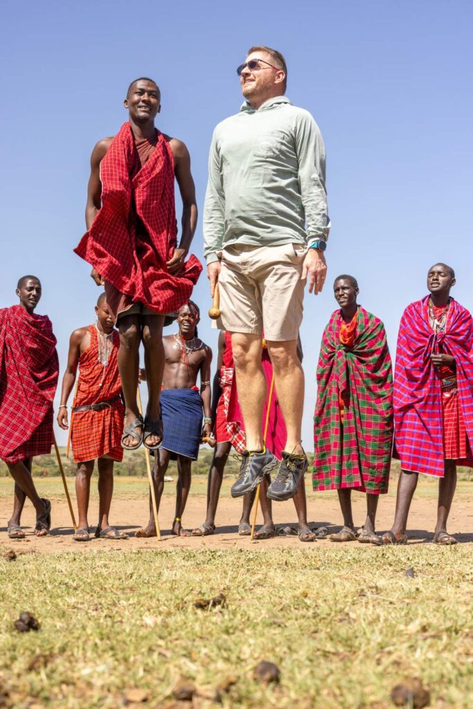 Maasai warriors performing traditional jumping dance during cultural experience at JW Marriott Masai Mara in Kenya