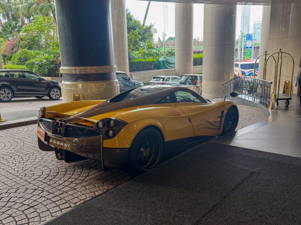 Pagani Huayra parked at the entrance of the Grand Hyatt Hong Kong, highlighting the hotel’s luxury atmosphere