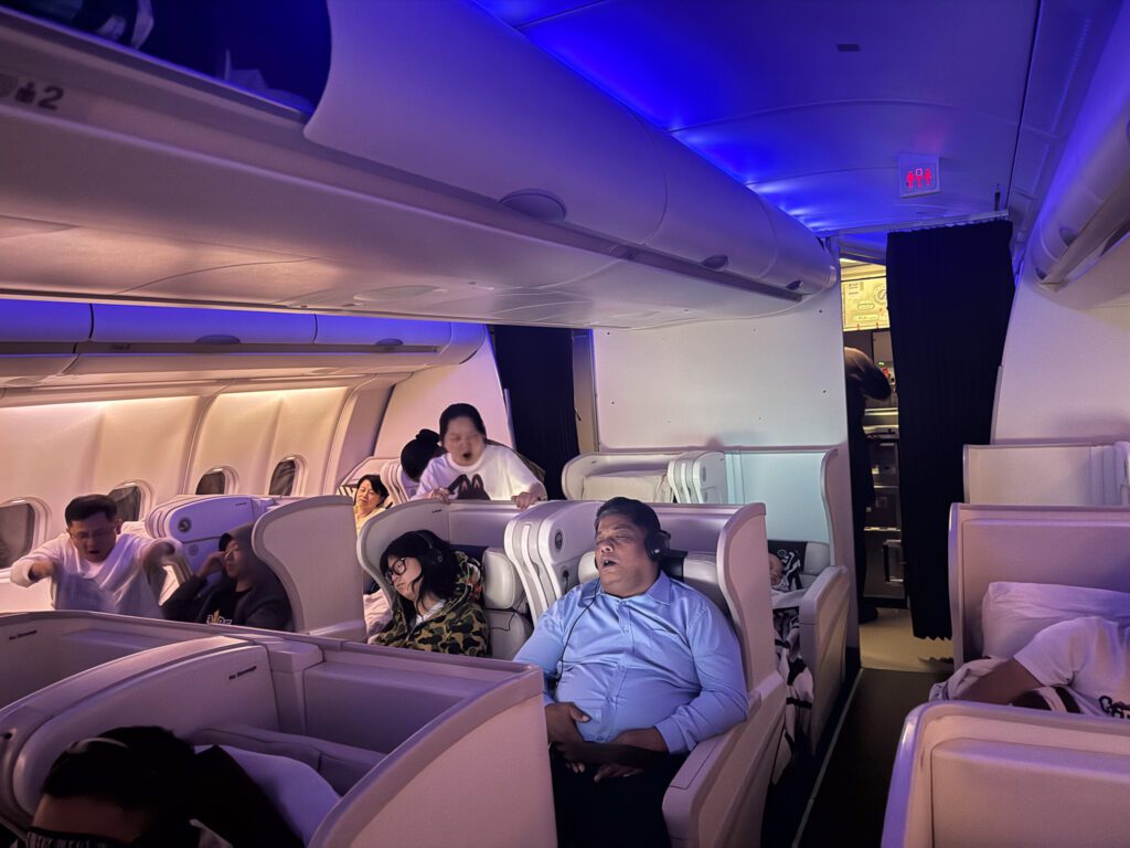 Fiji Airways A330 business class cabin with mood lighting during overnight Hong Kong to Nadi flight.