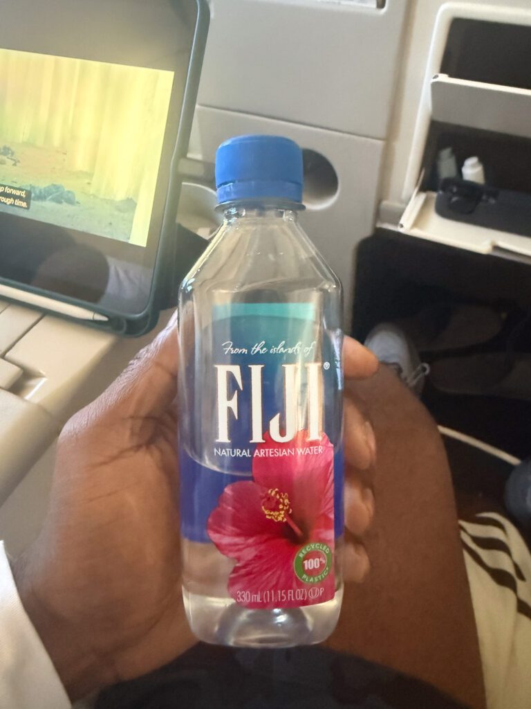 Fiji Water bottle served in Fiji Airways A330 business class cabin during flight from Hong Kong to Nadi.