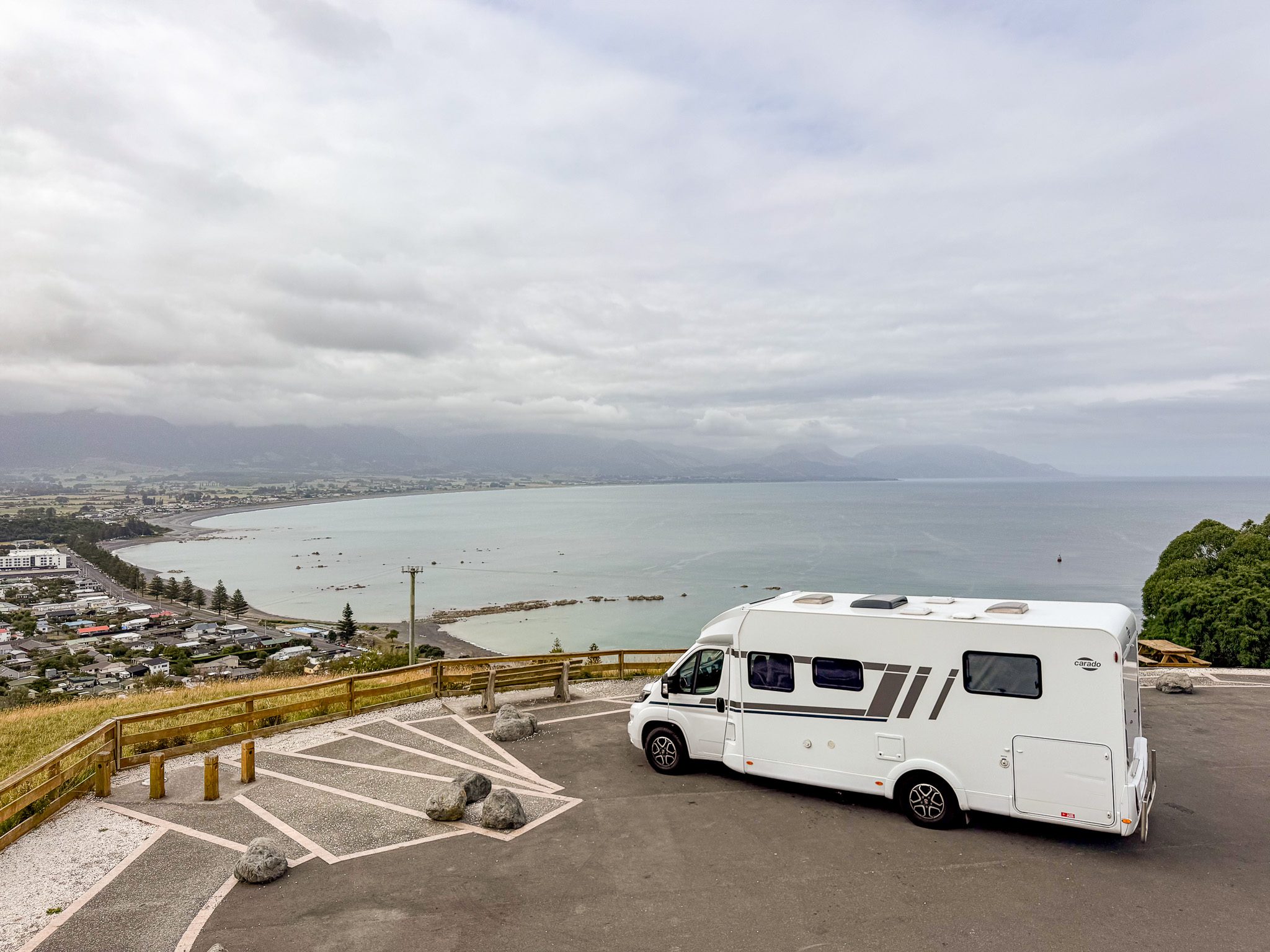 Luxury campervan parked at Kaikōura Lookout in New Zealand, overlooking the coastline during a two-week campervan road trip.