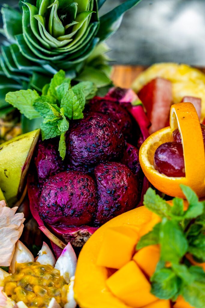 Colorful tropical fruit platter with dragon fruit, mango, passionfruit, and pineapple at Namale Resort & Spa.