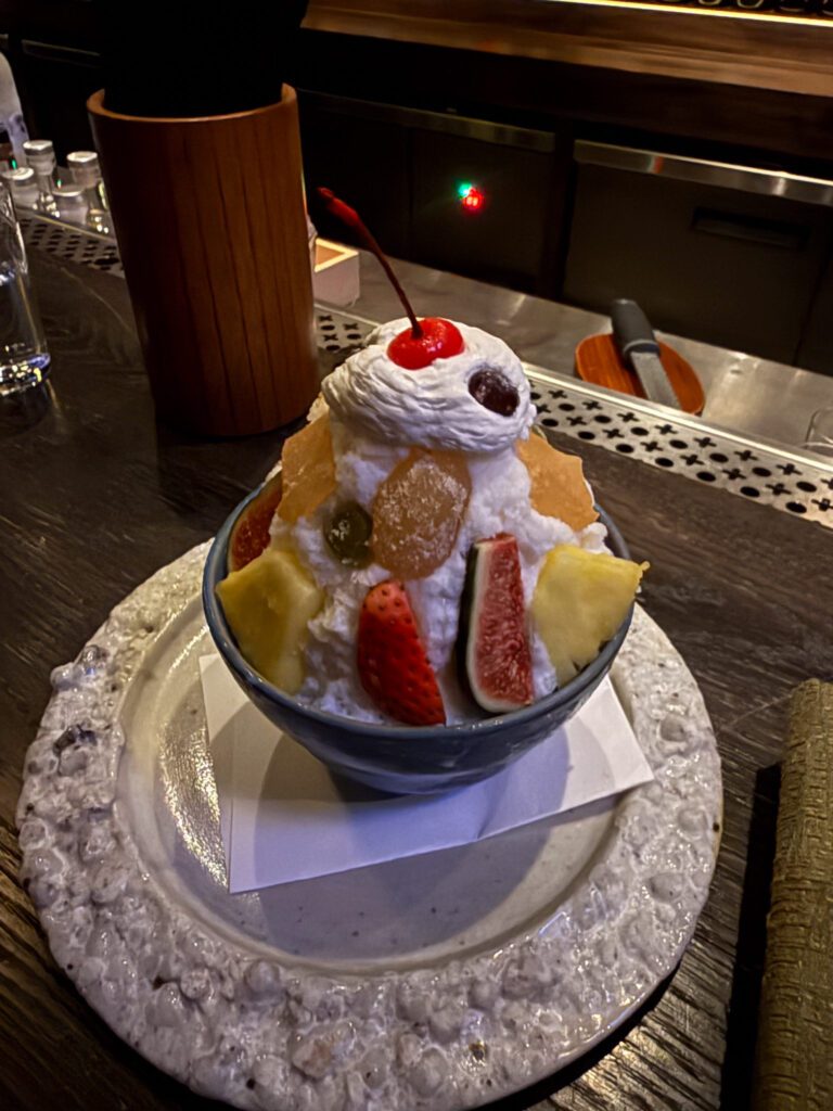 Japanese shaved ice dessert with fruit served at Gokan cocktail bar in Hong Kong