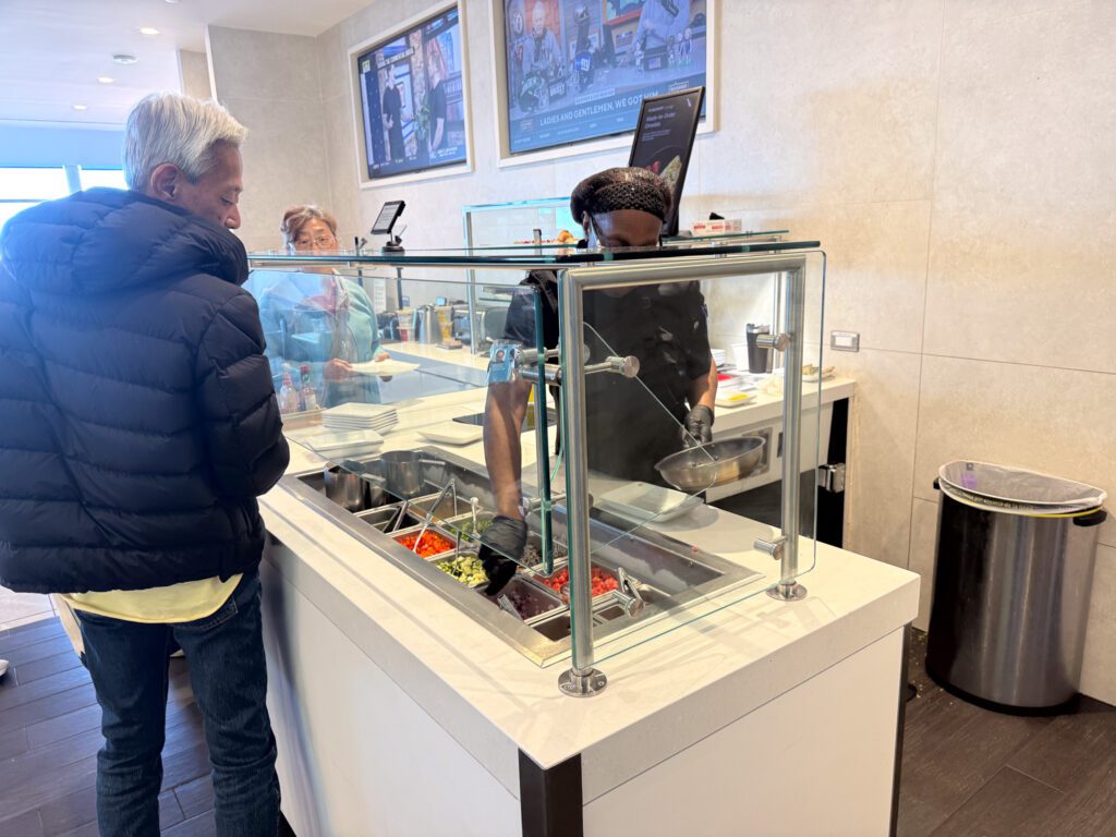 American Airlines Flagship Lounge made-to-order food station with fresh ingredients