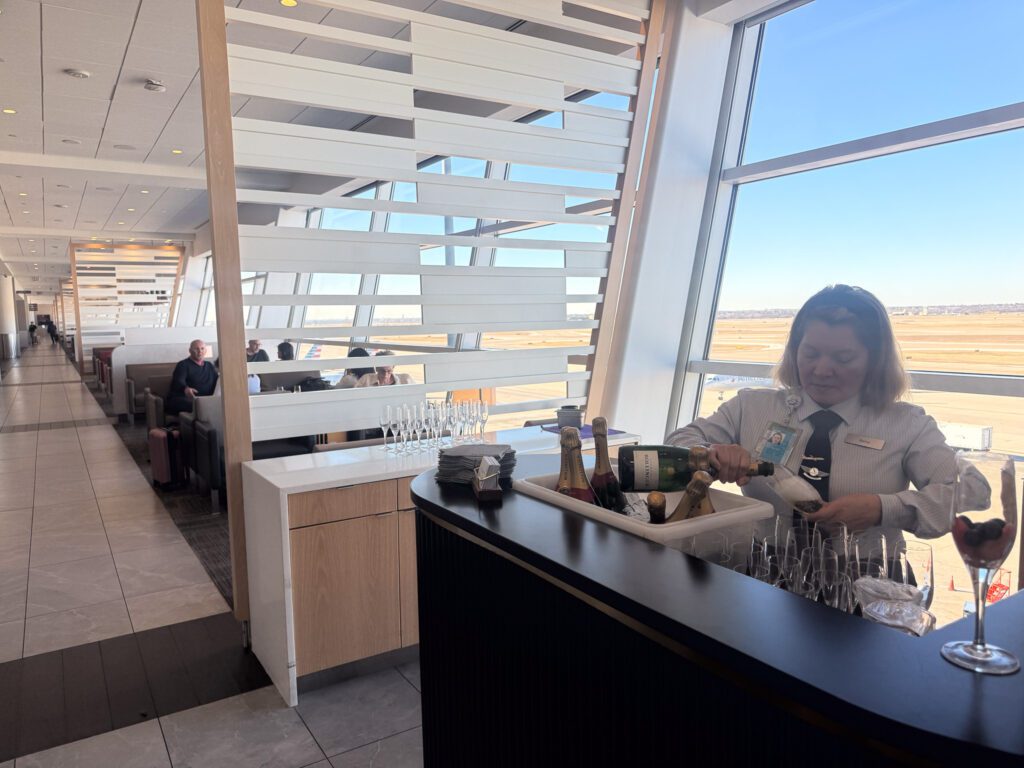 American Airlines Flagship Lounge champagne service with runway views