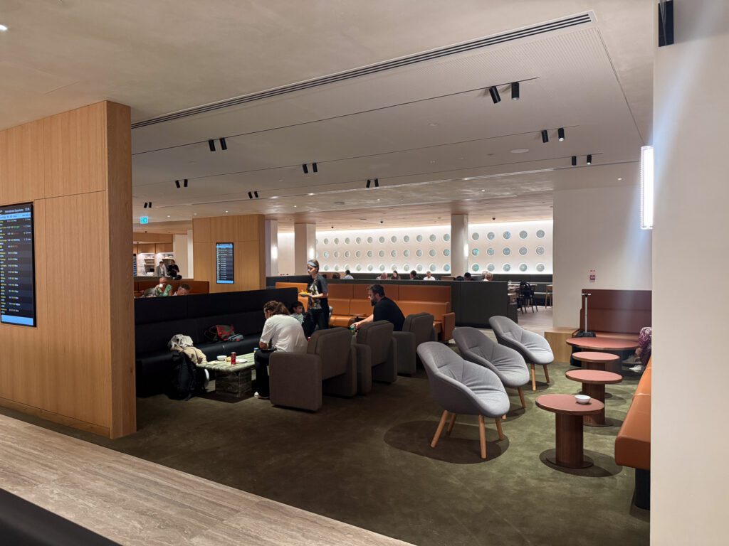Qantas Auckland Lounge seating area with couches and passenger relaxation spaces
