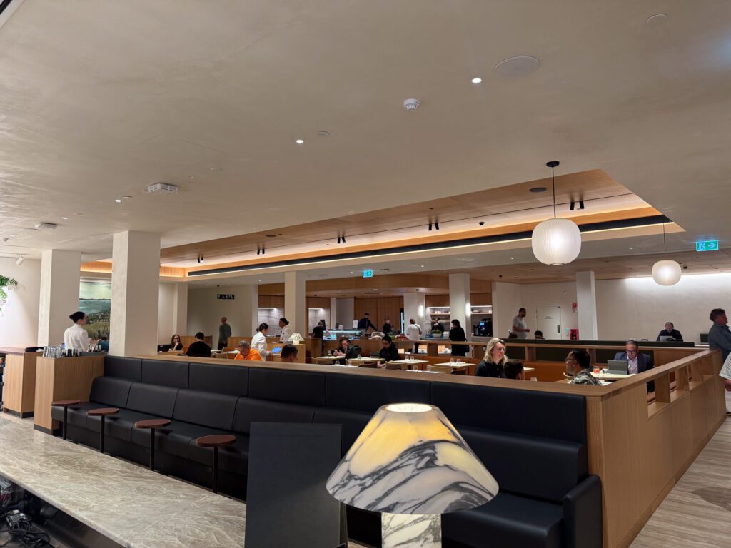 Qantas Auckland Business Class Lounge dining area with tables and buffet service