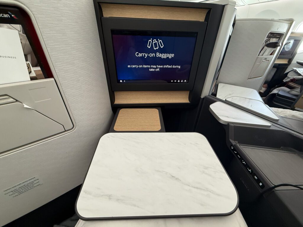 American Airlines 787-9 business class tray table and workspace setup