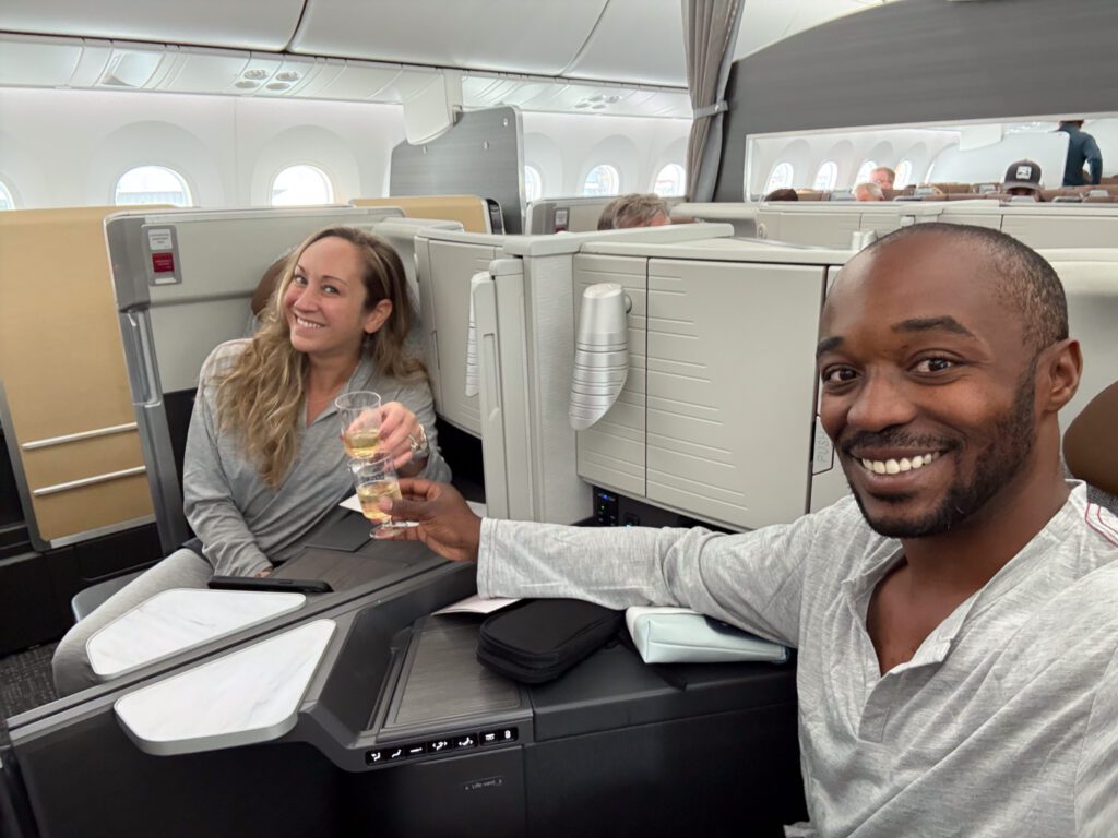 American Airlines 787-9 business class seats with passengers enjoying champagne