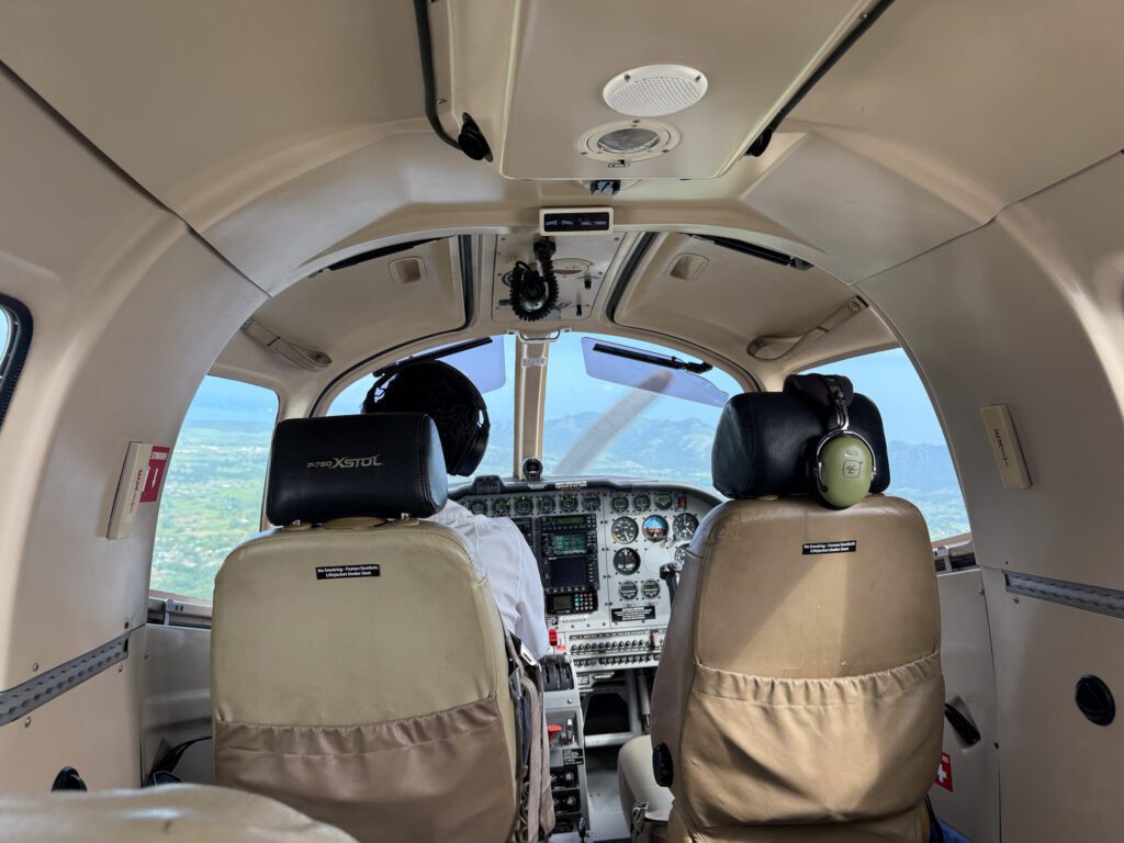 Interior cockpit view during scenic private flight transfer from Nanuku Resort Fiji to Nadi Airport