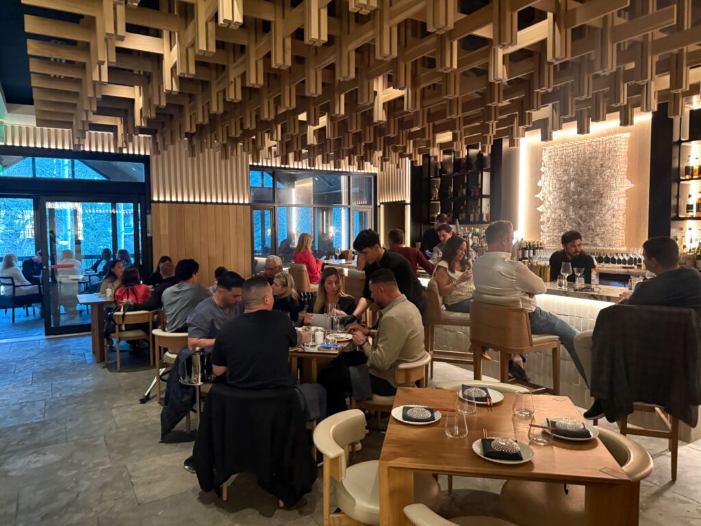 Dining room at Makoto Vail featuring modern Japanese design and lively dinner service