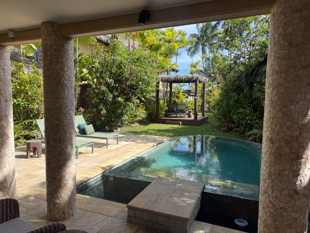 Private pool villa courtyard with tropical garden and plunge pool at Nanuku Resort Fiji