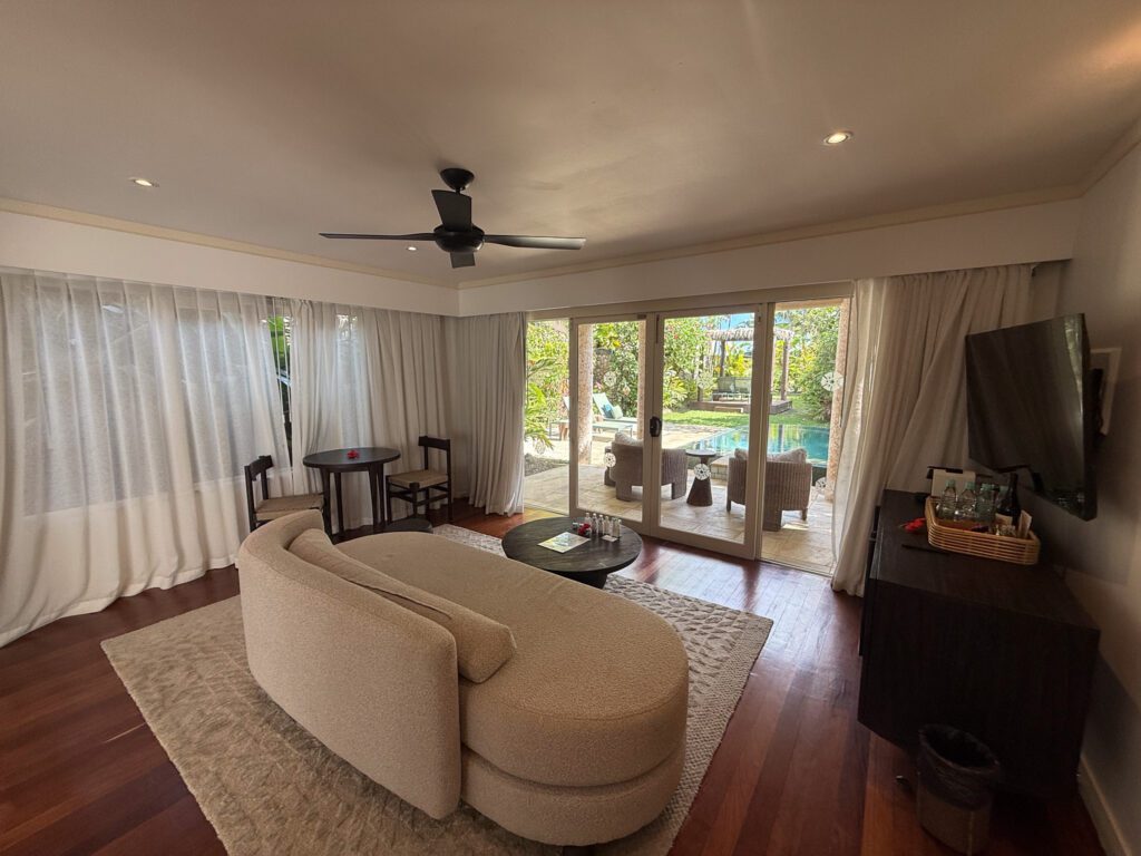 Spacious villa living area at Nanuku Resort Fiji opening directly to private pool terrace