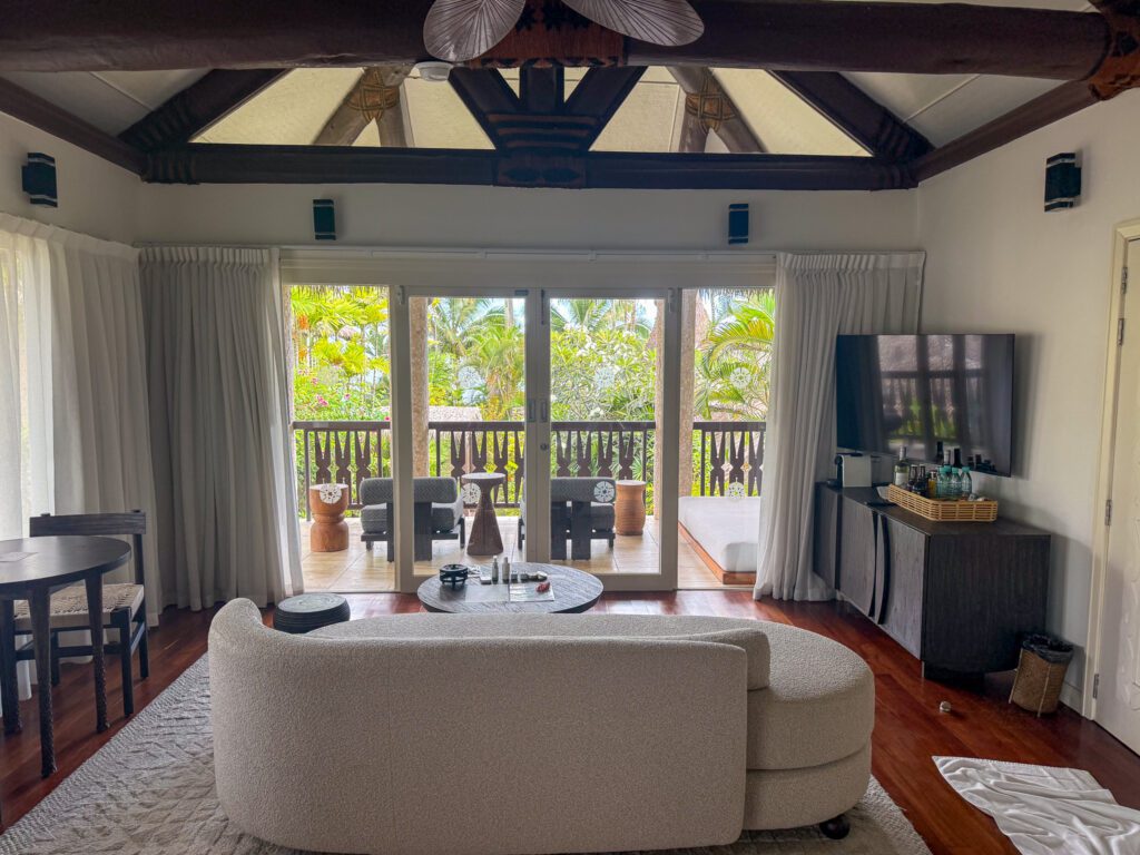 Upper-level villa suite at Nanuku Resort Fiji with private balcony overlooking tropical gardens